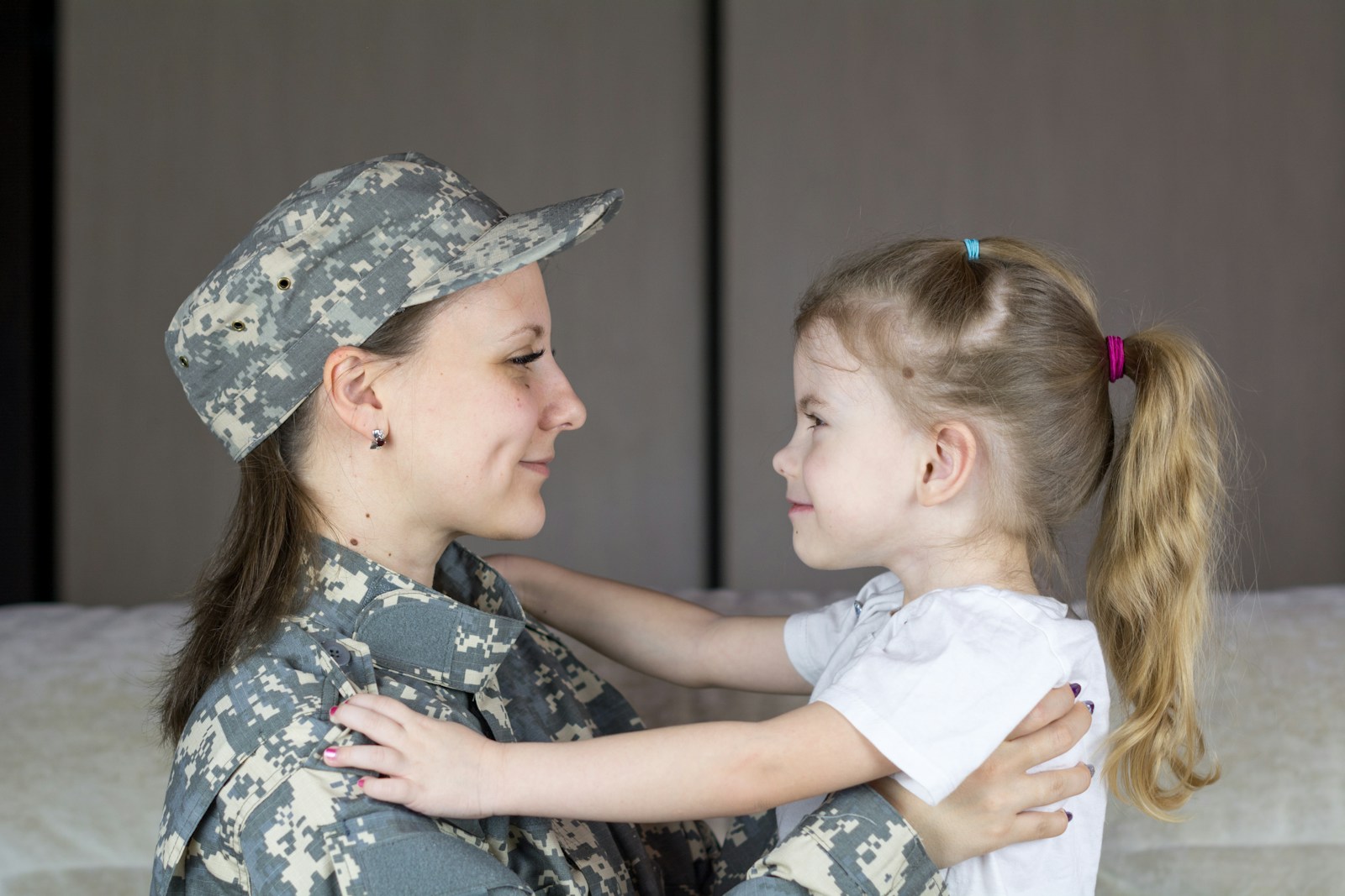 Service member with her family